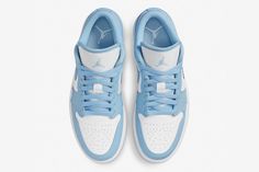 a pair of blue and white sneakers on a white background with the jordan brand logo