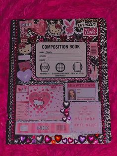 the composition book is decorated with pink hearts and other things to make it look like they are