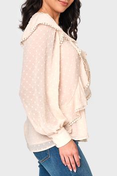 The Ophelia Ruffle Boho Blouse is made in a sheer chiffon fabric that features a textured dot, while the romantic trimmed ruffles add a touch of femininity. Perfect for any occasion, this blouse is a must-have addition to your wardrobe. 100% Polyester Delicate Wash Cycle, Lay Flat to Dry Length 25 1/2" (size small) Eased Fit Crew Neck Long Sleeve with 2-Button Cuff Lined Except Sleeves Easy 30-Day Returns & Exchanges Sabrina is 5'7 and wearing XS Feminine Ruffled Blouse For Daywear, Flowy Feminine Blouse With Ruffles, Flowy Chiffon Blouse With Ruffles, Feminine Flowy Blouse With Ruffles, Elegant Flowy Blouse With Ruffle Hem, Elegant Polka Dot Swiss Dot Blouse, Feminine Beige Blouse With Ruffled Collar, Feminine Blouse With Ruffle Hem And Ruffled Collar, Feminine Polka Dot Party Blouse