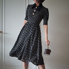 A classic polka dot dress full of elegance. This item has a noble atmosphere from the good old days, with attention to detail in the decoration. The high waist makes it look stylish, and the moderate length gives it a neat and elegant look. 
 
 
 
 
 
 
 
 
 
 Color 
 
 Black collar 
 White collar 
 
 
 Size 
 
 
 XS size 
 
 Length: 105cm 
 Shoulder width: 34.5cm 
 Bust: 80cm 
 Waist: 62cm 
 
 
 S size 
 
 Length: 109cm 
 Shoulder width: 35cm 
 Bust: 84cm 
 Waist: 66cm 
 
 M size 
 
 Length: 10 Elegant A-line Midi Dress For Vintage Fashion, Elegant Polka Dot Midi Dress For Evening, Elegant Spring Midi Dress For Vintage Fashion, Elegant Spring Vintage Fashion Midi Dress, Elegant Summer Midi Dress For Vintage Fashion, Elegant Knee-length Midi Dress For Vintage Fashion, Elegant Summer Vintage Fashion Midi Dress, Elegant Knee-length Midi Dress In Vintage Style, Polka Dot Midi Dress For Formal Occasions