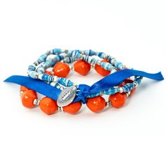 Are you a Tennessee, Auburn, or Florida fan? This is the bracelet for you! These fun bracelets come in a variety of colors and are made of 100% recycled paper beads handcrafted by Masai women. In between each bead are beautiful faceted copper, brass, or silver spacers. They are perfect to stack with any of our other paper bead bracelets or mix it up with one of your own! How you can make a difference: Each bracelet provides 200,000 gallons of clean water. Just 5 bracelets = 1 water filter = 1 mi Masai Women, Paper Bead Bracelet, Triple Wrap Bracelet, Orange Bracelet, Fun Bracelet, Bead Bracelets, Paper Beads, Linen Bag, Women Artisans