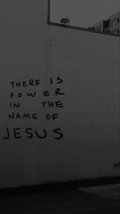 there is power in the name of jesus written on a wall next to a basketball hoop