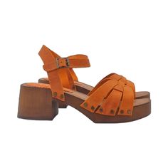 Add a pop of vibrant color to your look with these orange genuine leather sandals Clogs with brown wood effect base Leather upper Soft leather insole Adjustable ankle strap Heel height 6 cm with 3 cm platform Handmade product in Italy The craftsmanship and use of the best materials translate into a very high quality product, perfect for enhancing your elegance on every occasion. BEFORE MAKING THE PURCHASE DO NOT FORGET TO CHECK THE SIZE! --- This handmade item is made and designed entirely by the craftsman Gennaro Duello, founder of Kiara Shoes, Gioie Italiane and My Clogs. Orange Platform Sandals With Ankle Strap, Orange Closed Toe Mules For Summer, Summer Orange Closed Toe Mules, Orange Mules With Removable Insole And Round Toe, Orange High Heel Sandals With Buckle Closure, Summer Clogs With Wooden Low Heel, Orange Ankle Strap Heels With Stacked Heel, Orange Leather Heels With Buckle Closure, Orange Leather Round Toe Clogs