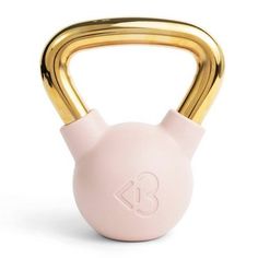 a pink kettle with gold handles on a white background and the letter b is in the middle