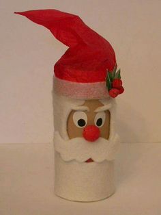 a toilet paper roll with a santa claus face on it