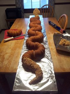 there are many donuts on the table ready to be baked in the oven,