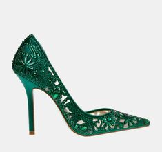 a green high heeled shoe with an intricate lace design on the toe and pointed toes