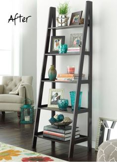 a living room filled with furniture and a book shelf next to a chair in front of a window