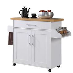 a white kitchen cart with wooden top and two drawers on wheels, holding coffee cups