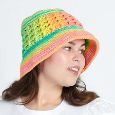 a woman wearing a multicolored crocheted hat