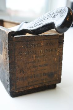 an old wooden box sitting on top of a table