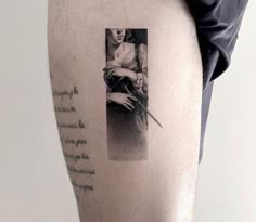 a woman with a knife in her hand and some words on the back of her leg