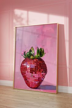 a pink wall with a large red mosaic strawberry on it