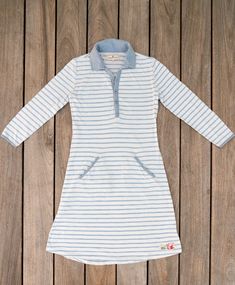 Inspired by the uniform of the French Navy, our super soft cotton striped dress is the BEYC take on a maritime classic. Our version of the iconic Breton style has three-quarter sleeves, Bitter End buttons at the turned-up cuffs, and vintage BEYC patch at the hem. Set a course in this classic, sailor style. 100% cotton Three-quarter sleeves Flattering feminine fit Vintage patch at hem Bitter End distressed metal buttons, pre-washed fabric Care instructions: Machine wash cold separately, do not bl Long Sleeve Cotton Dress With Striped Collar, Cotton Long Sleeve Dress With Striped Collar, Cotton Dress With Striped Collar And Long Sleeves, White Long Sleeve Dress With Striped Collar, Fitted Cotton Nautical Dress, Spring Cotton Dresses With Contrast Stripes, Spring Nautical Cotton Dress, Breton Style, Cotton Stripe Dresses