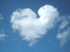 a heart shaped cloud with the words love is in the air just breathe life by design media