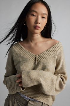 Forever staple BDG sweater in an effortless pullover sweater style. Designed in a boxy & cropped fit featuring a wide v-neckline and drop shoulders for a slouchy look. Finished with ribbed knit trim. Find it only at Urban Outfitters. Features BDG Jenna cropped v-neck sweater Slouchy oversized sweater Soft and stretchy knit Wide v-neckline and long sleeves with ribbed knit trim Ribbed knit hem Boxy, relaxed fit Cropped length Easy pullover style UO exclusive Contents + Care 53% Recycled polyester Slouchy Sweater, Women Men Shoes, Exclusive Collection, Vneck Sweater, Ribbed Knit, Urban Outfitters, Fitness Models, Labour Day, Topshop