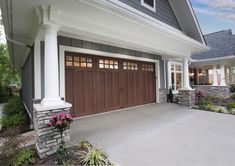 a large house with two garage doors on each side