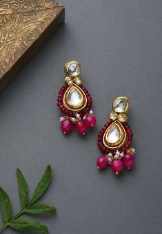 Kundan work inspired Indian earrings with high graded pink stones. Earrings based in silver and copper alloy and embellished with faux kundan. This beautifully handcrafted earrings are set in silver and copper alloy and plated with 22k gold. It will go with everything and make your outfit super chic. Perfect to wear to dinner, and perfect gift for family members, friends or bridesmaid. LENGTH Earrings Length - 3 inch Closure - Push Pin DETAILS -100% top Quality Faux kundan -22K gold and silver P Red Earrings For Formal Festive Occasions, Red Festive Earrings For Formal Occasions, Red Formal Earrings For Festive Occasions, Traditional Red Pearl Earrings For Formal Occasions, Traditional Pink Earrings For Formal Occasions, Red Pearl Drop Earrings For Festive Occasions, Festive Red Pearl Drop Earrings, Red Pearl Earrings For Celebration, Red Dangle Pearl Earrings For Festive Occasions