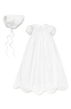 Puffed short sleeves and a scalloped hem detail this flowing, hand-smocked gown, and a matching bonnet with grosgrain ribbon ties completes the classic look. Style Name:Kissy Kissy Caroline Christening Gown & Bonnet Set (Baby). Style Number: 5760569. Available in stores. Blessing Dress, Baptism Gown, Designer Baby Clothes, Kissy Kissy, Christening Gown, Christening Gowns, Hem Skirt