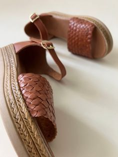 These premium quality shoes are made from Mexican leather, feature a beautiful woven leather design and has a quarter strap with a buckle closure. The soles are comfortable and light, allowing for maximum wear. These are the highest quality in Artisanal leather shoes. They are completely made by hand, making them one of a kind. Brown Woven Leather Closed Toe Sandals, Brown Woven Leather Closed-toe Sandals, Leather Woven Huarache Sandals With Ankle Strap, Leather Woven Ankle Strap Huarache Sandals, Brown Woven Leather Huarache Sandals, Brown Sandals With Woven Sole And Round Toe, Brown Leather Huarache Sandals With Woven Sole, Brown Woven Leather Open Toe Huarache Sandals, Braided Leather Ankle Strap Sandals