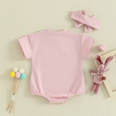 Keep your little one looking both adorable and comfortable with this pink BUNNIES Romper! Embroidered with a cute bunny design, it's the perfect outfit for her Easter egg hunting and beyond. Short Sleeve Cotton Bubble Romper, Cute Solid Color Playwear Sets, Pink Cotton Onesie For Spring, Pink Cotton Bubble Romper With Short Sleeves, Cute Solid Color Spring Onesie, Casual Bubble Romper With Short Sleeves, Casual Solid Color Short Sleeve Bubble Romper, Playful Pink Onesie For Playwear, Solid Color Short Sleeve Onesie For Playwear