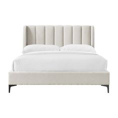 an upholstered bed with white linens and gold legs on a white background