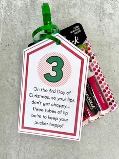 a christmas gift tag with the number three on it