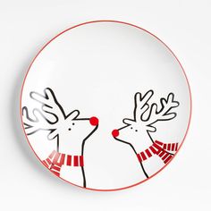 a plate with two reindeers painted on it