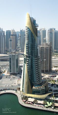 an aerial view of a tall building in the middle of a city