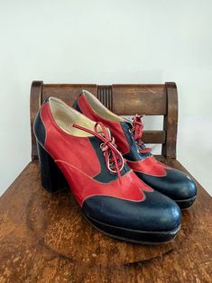 1960s Red + Navy Platform Lace Up Mary Janes- 6.5 Fabulous, 1960s color block, platform Mary Janes. I love these because they have a high heel, but the grade or angle of the sole is likely very comfortable to walk about it due to the platform at the front of the shoe. Structurally in good condition, soles are in nice shape as well. There are superficial scuffs, all shown in photos. Surely guaranteed to spice up any outfit! Marked size 6.5.  Size: 6.5 Sole length: 9.75" Width: 2.75" Front platform: 3/4" Heel: 3.5" Vintage Red Round Toe Heels, Vintage Red Heels With Round Toe, Retro Red Almond Toe Heels, Retro Heels With Red Sole And Round Toe, Retro Heels With Red Sole And Almond Toe, Vintage Heels With Red Sole And Round Toe, Retro Red Heels For Formal Occasions, Vintage Almond Toe Heels With Red Sole, Vintage Red Almond Toe Heels