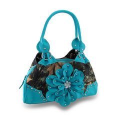 This Fun And Chic Carpet Bag Style Purse Features A Forest Camo Print Accented By Textured Vinyl Trim Highlighted With Chrome Studs And Clear Faceted Jewels, And A Studded Flower Made Of Vinyl Petals With A Sparkling Rhinestone Center. Made With A Durable Nylon Canvas Construction, This Stylish 16 Inch Long, 8 Inch High, 4 Inch Wide (41 X 20 X 10 Cm) Handbag Has Plenty Of Room To Stash Your Stuff While The 3/4 Inch Wide Twin Rolled Handles Attached By Chrome Chain Links Provide An 11 Inch Drop. Luxury Blue Coach Shoulder Bag, Luxury Coach Canvas Shoulder Bag, Luxury Coach Women's Wallet On Chain, Carpet Bag Purse, Camo Purse, Quilted Wallet, Green Handbag, Carpet Bag, Blue Purse