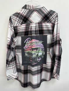 "Show off some Bronco Love in this one-of-a-kind flannel! Women's XL Sonoma upcycled flannel. Grey old school Ford Bronco tee sewn on back. Size: Women's XL Brand: Sonoma Chest: 24\" armpit to armpit Arm Length: 24\" shoulder to hem Back Length: 32\" top of collar to hem Color: Cream and black plaid with burgundy  Material: cotton All clothing is pre-washed & comes from a smoke-free home. Wash gentle cycle, cold water  Tumble dry low Don't iron over graphic tee Please check measurements, sizing Long Sleeve Flannel Top With Graphic Print, Vintage Long Sleeve Graphic Print Flannel Shirt, Vintage Flannel Top With Graphic Print, Vintage Plaid Tops With Graphic Print, Fall Long Sleeve Flannel Shirt With Graphic Print, Fall Graphic Print Long Sleeve Flannel Shirt, Fall Flannel Top With Graphic Print, Plaid Cotton Flannel Shirt With Graphic Print, Fall Flannel Shirt With Graphic Print