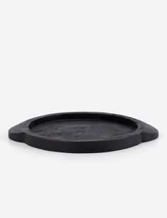 an empty black tray on a white background