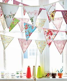 colorful buntings hanging from a window sill