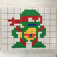 an art piece made out of legos with the teenage mutant on it's face