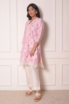 Baby pink chanderi kurta in floral thread work. Paired with lace hem pant.
Component: 2
Pattern: Embroidered
Type Of Work: Thread work
Neckline: V neck
Sleeve Type: Three quarter
Fabric: Chanderi
Color: Pink
Other Details: 
Organza scallop trims
Pintuck hem pant
Occasion: Mehendi and Haldi - Aza Fashions V Neck Kurta, Pink Thread, How To Hem Pants, Lace Hem, Fashion App, Thread Work, Pant Set, Set For Women, Aza Fashion