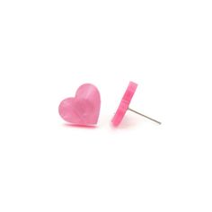 "Add a little love to your everyday wardrobe with these pink pearl heart stud earrings. Made of marbled pink acrylic these earrings are feminine and sweet. These earrings are laser cut from acrylic so they are lightweight and comfortable for your ears. Earrings measure 13mm (about .51\") tall and 14mm wide (about .55\"). Earring posts are nickel and lead free for sensitive ears and come with comfort clutch type backs to keep the earring snug to your ear. ★ ★ ★ Become a VIP and get 20% off your f Trendy Pink Heart Earrings For Gift, Trendy Pink Heart Earrings As Gift, Pink Heart Earrings For Everyday, Pink Heart-shaped Everyday Earrings, Hypoallergenic Pink Heart Earrings, Hypoallergenic Heart-shaped Pink Earrings, Pink Hypoallergenic Earrings For Valentine's Day, Pink Pearl Earrings, Pearl Heart