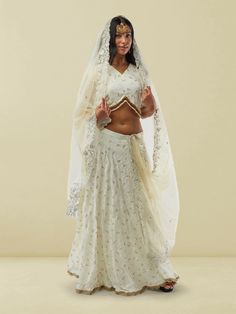 Adorn yourself in elegance with our Ethnochic White Banarasi Georgette Self Embroidered Lehenga with Lace Work. This exquisite lehenga features intricate self-embroidery and delicate lace work on a pristine white Banarasi Georgette fabric, creating a mesmerizing look for any special occasion. The flowing silhouette and detailed craftsmanship make this lehenga a perfect choice for wedding guests or festive events. To care for this garment, we recommend gentle hand washing in cold water to maintai Georgette Lehenga, Embroidered Lehenga, Festive Look, Georgette Fabric, Wedding Guests, Leggings Shop, Salwar Kameez, Large White, Mommy And Me