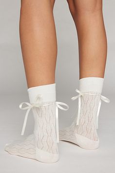 Oh-so-soft crew socks topped with a tonal ribbon tied in a bow. Features Ariana bow crew socks Seriously soft crew socks Tonal satin ribbon accent Content + Care 80% Cotton, 15% polyester, 5% spandex Machine wash Imported Size Crew length | Ariana Bow Crew Sock in White, Women's at Urban Outfitters White Socks Aesthetic, Cute Socks Aesthetic, Twilight Dr, Weird Kid, Aesthetic Socks, Bow Socks, Statement Socks, Pretty Socks, Socks Aesthetic