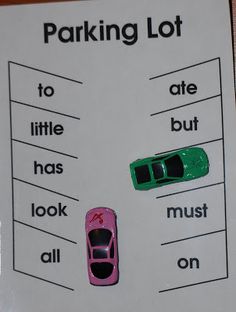 a parking lot sign with two cars on it and the words'parking lot '