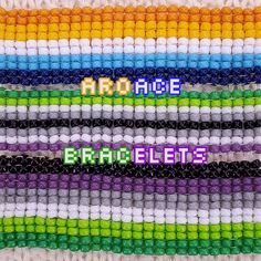 the word arcade spelled in different colors on a multi - colored beaded wallpaper