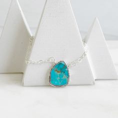 The sweetest and most unique piece for your jewelry collection. This necklace can be layered, or worn alone. GEMSTONE: Turquoise SIZE: Varies in size from 12mm-24mm CHAIN: 17" long sterling silver CLOSURE: Lobster clasp *PLEASE NOTE - Due to the one-of-a-kind nature of the stones, exact colors and patterns may vary slightly from the image shown. Silver Turquoise Jewelry, Simple Jewelry, Turquoise Gemstone, Turquoise Sterling Silver, Turquoise Jewelry, Layered Necklaces, Lobster Clasp, Unique Pieces, Jewelry Collection