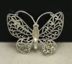 Sterling silver brooch - Butterfly, 925/1000. Stamped 925. Approximate weight 4.0 grams. Dimensions 3.5x2.9cm. All our jewels are made from solid sterling silver 925/1000 and are carefully crafted by hand in our family workshop. We dispatch your orders in 5 working days, worldwide and the postage is $5. We ship registered priority mail. Please allow 5-7 working days for delivery in Europe and 10-15 working days outside Europe. For any questions - please do not hesitate to contact me! Sterling Silver Brooch Jewelry, Sterling Silver Brooch In Silver, Unique Sterling Silver Brooch In Silver, Sterling Silver Brooch Jewelry In Silver, Silver Sterling Silver Pendant Brooches, Classic Silver Brooch, Silver Pendant Brooch For Formal Occasions, Formal Silver Pendant Brooch, Sterling Silver Brooch Stamped 925 As Gift