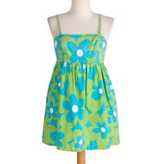 Adorable green mini dress from the 60s with blue flowers. With spaghetti straps and zipper in back. Straps can unbutton at bust to get in and out easily. 100% cotton. Measurements Bust: 32"  Waist: 28" Hips: 50" Length: 29" Sweep: 50" Condition: Great; some tiny holes on inside of bust (See image) Fitted Green Cotton Sundress, Green Mini Sundress With Adjustable Straps, Green Cotton Mini Dress With Spaghetti Straps, Green Dress With Adjustable Straps For Garden Party, Green Cotton Lined Mini Dress, Green Spring Dresses With Adjustable Straps, Green Spring Dress With Adjustable Straps, Spring Green Dresses With Adjustable Straps, Green Cotton Dresses With Adjustable Straps