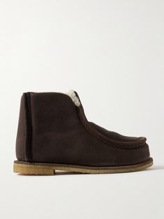 JW Anderson’s boots are modeled on classic Chukka styles. Crafted from suede, they're fully lined in shearling to keep your foot nice and cozy in cold climes. Rubber soles provide plenty of traction on slick surfaces. Suede Ankle-high Chukka Boots With Stitched Sole, Luxury Suede Mid-calf Boots With Round Toe, Luxury Suede-lined Chukka Ankle Boots, Brown Suede Lace-up Boots With Stitched Sole, Brown Slip-on Chukka Boots With Stitched Sole, Shoes Boots Ankle, Jw Anderson, Brown Ankle Boots, Flat Sneakers