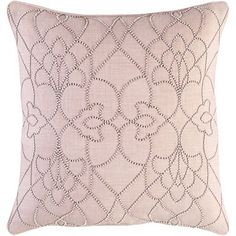 a light pink pillow with an intricate design on it