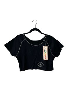 "1981 danskin crop top. NWT. black with white contrast stitching. short sleeve. 13.5\" long. 19\" across. 7\" sleeves. in excellent, unworn condition. made in USA. legit. legitbabes.etsy.com legitbabes on instagram." Casual Fitted Tops With Contrast Stitching, Summer Tops With Contrast Stitching And Short Sleeves, Summer Cotton Activewear With Short Sleeves, Cotton Crop Top For Sports With Relaxed Fit, Relaxed Fit Short Sleeve Athleisure Crop Top, Relaxed Fit Short Sleeve Crop Top In Athleisure Style, Athleisure Relaxed Fit Crop Top With Short Sleeves, Athleisure Crop Top With Relaxed Fit And Short Sleeves, Fitted Tops With Contrast Stitching For Spring