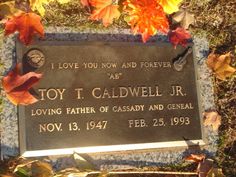 a plaque in the grass that says toy i cadwell jr loving father of gadsby and general