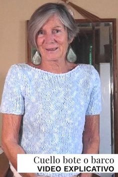 an older woman standing in front of a mirror with her hands on her hips and looking at the camera