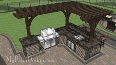 an outdoor kitchen with grill and seating area